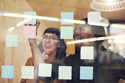 Buy stock photo Cropped shot of two designers having a brainstorming session