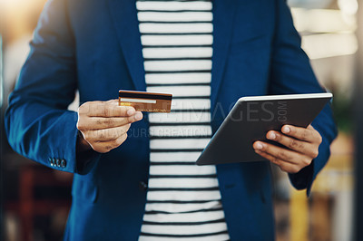 Buy stock photo Cropped shot of an unrecognizable businessman using his credit card online