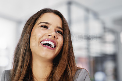Buy stock photo Cropped shot of a confident young businesswoman laughing in an office