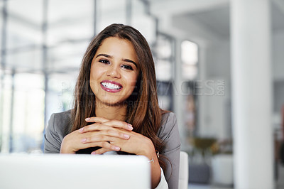 Buy stock photo Cropped portrait of a confident young businesswoman working in an office