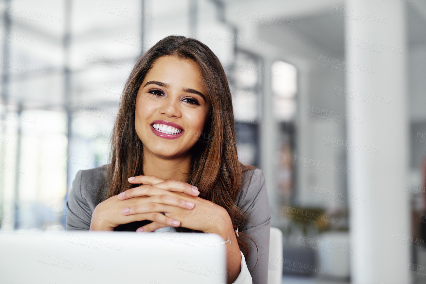 Buy stock photo Cropped portrait of a confident young businesswoman working in an office