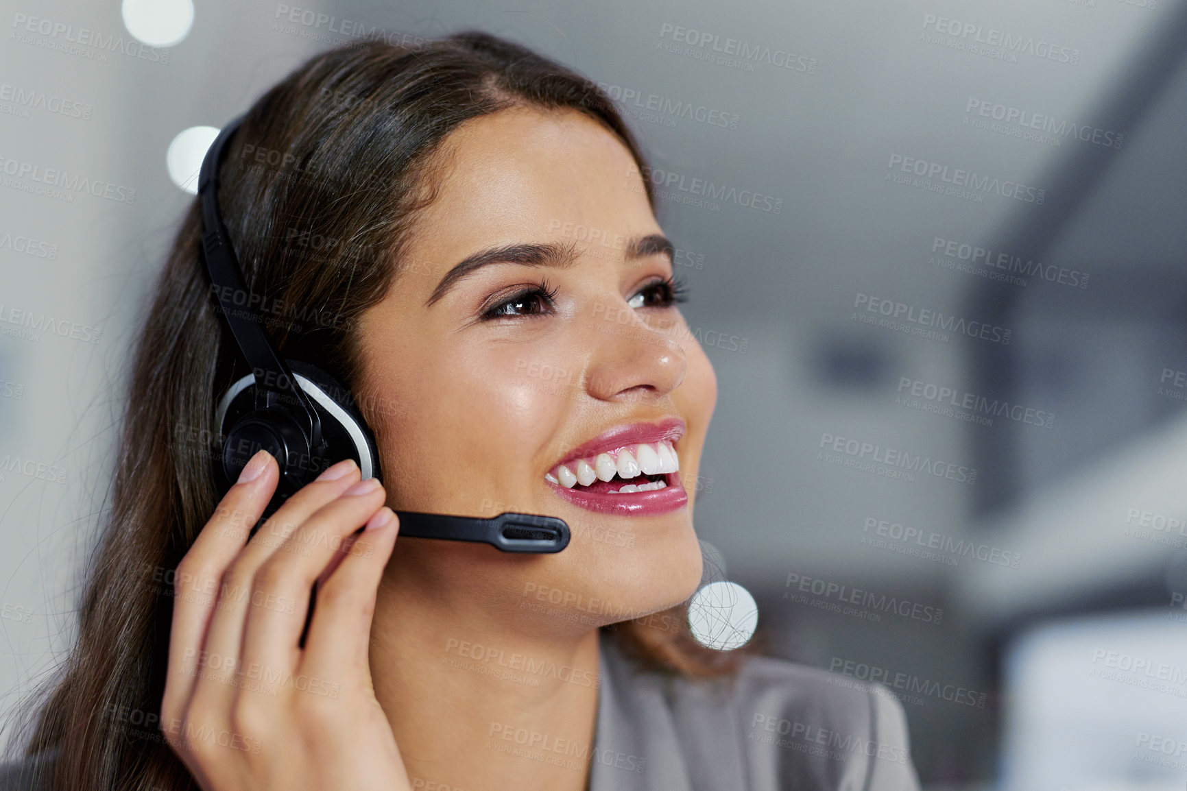 Buy stock photo Cropped shot of a young female call center agent working in an office