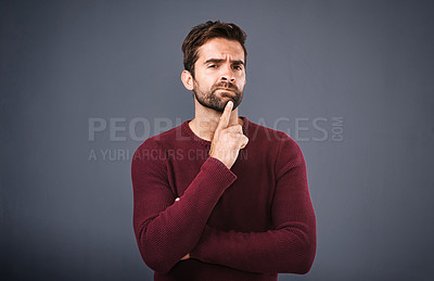 Buy stock photo Doubt, thinking and portrait of man in studio with unsure, uncertain and thoughtful on gray background. Confused, mockup space and face of male person skeptical for decision, choice and question