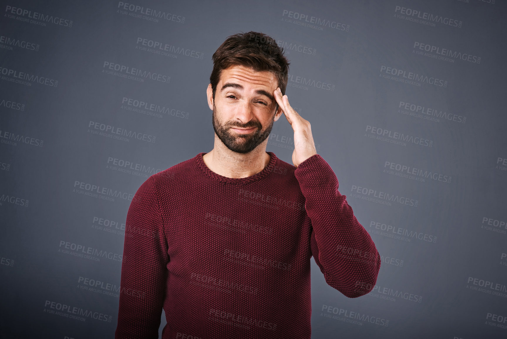 Buy stock photo Tired man, portrait and stress with headache in debt, depression or anxiety on a gray studio background. Frustrated male person or young model with migraine, injury or sore head in burnout or strain