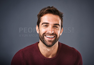 Buy stock photo Confidence, face and smile of man in studio, sweater and warm for winter in Canada, happy and discount. Gray background, portrait and joy of person, sale and cardigan of cotton, clothes and jersey