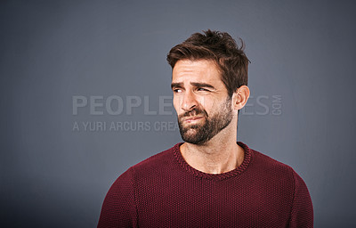 Buy stock photo Doubt, thinking and face of unsure man in studio with worry, uncertain and thoughtful on gray background. Confused, mockup space and isolated male person skeptical for decision, choice and question