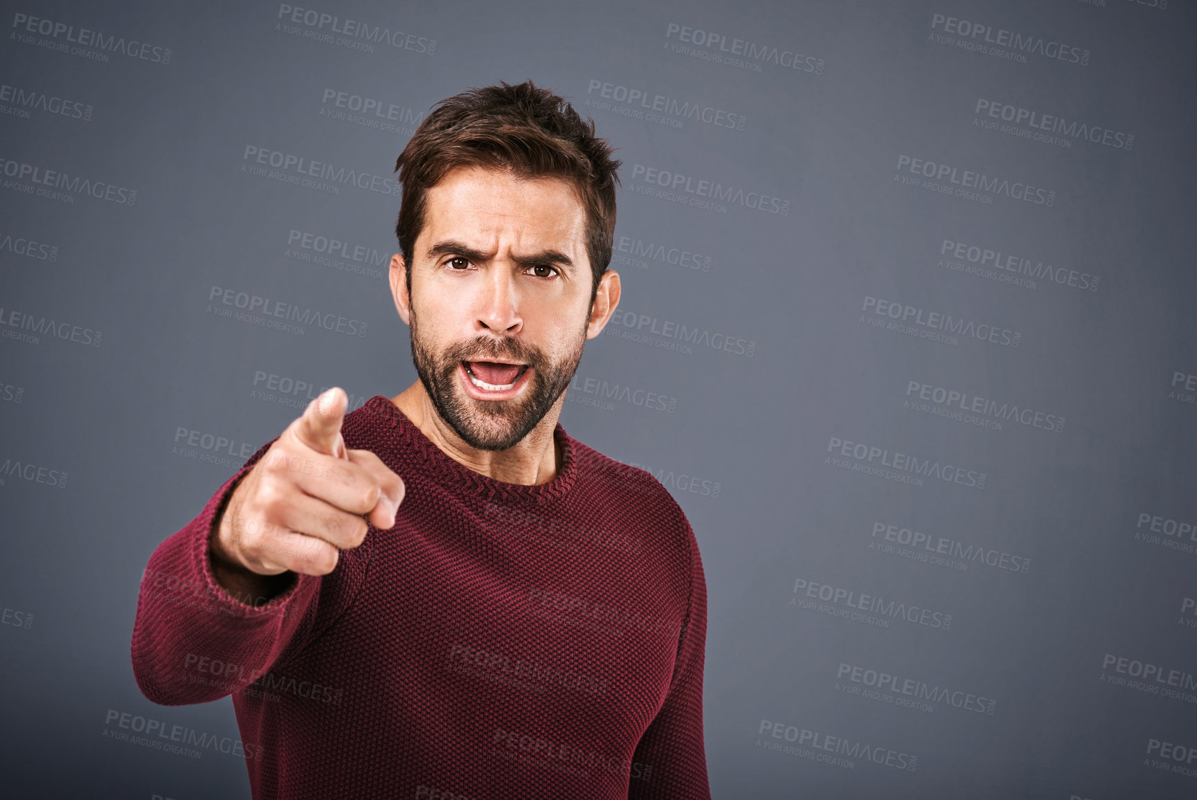 Buy stock photo Studio, angry and portrait of man, pointing and accountability for you, shouting and reprimanding. Gray background, face and person with hand, scolding and serious of opinion and banner in England