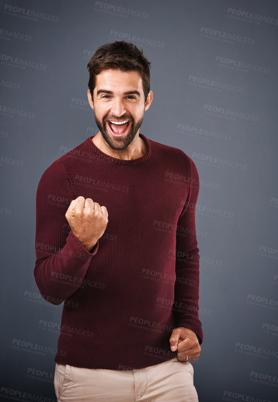 Buy stock photo Success, fist and excited man in studio with celebration, achievement or yes for bonus, competition or lottery. Happy winner in portrait with motivation for news or opportunity on gray background