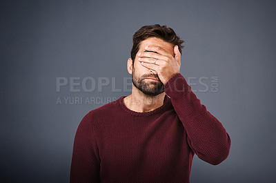 Buy stock photo Shame, man and cover of face, studio and disappointed of fail of party in elections and headache. Gray background, palm and hand to hide eyes, embarrassed and sad student in politics and unhappy