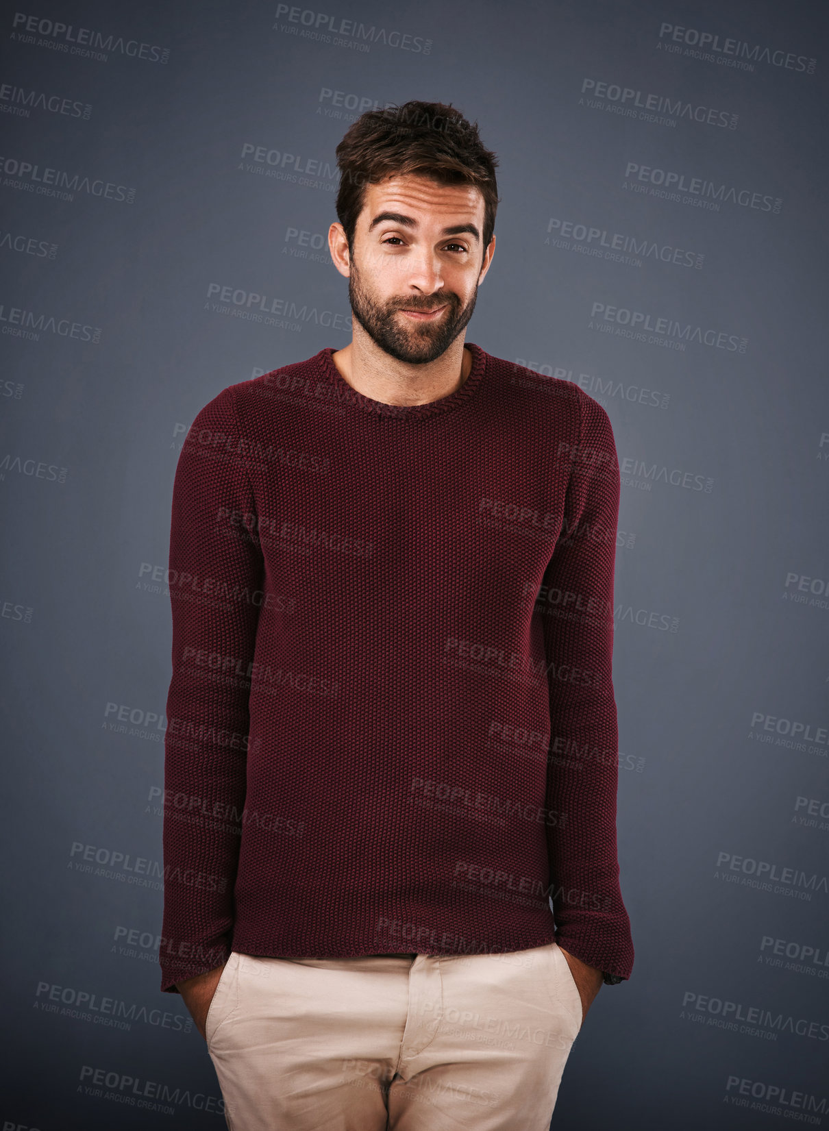 Buy stock photo Young man, portrait and shoulder shrug with fashion for clueless, question or uncertain expression on a gray studio background. Male person, hipster or model with jersey in casual clothing for style