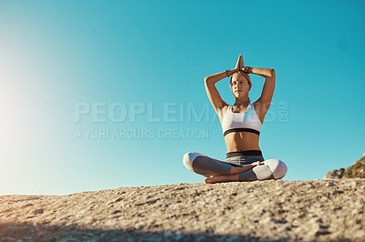 Buy stock photo Shot of a young woman doing yoga at the beach