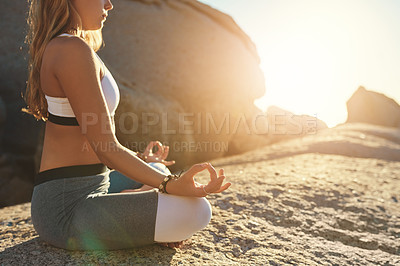 Buy stock photo Shot of a young woman doing yoga at the beach