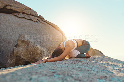 Buy stock photo Shot of a young woman doing yoga at the beach