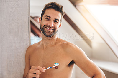 Buy stock photo Portrait, shirtless and happy man brushing teeth in bathroom for dental wellness, healthy smile and body with care at home. Sexy guy, toothbrush and oral cleaning for fresh breath and morning hygiene