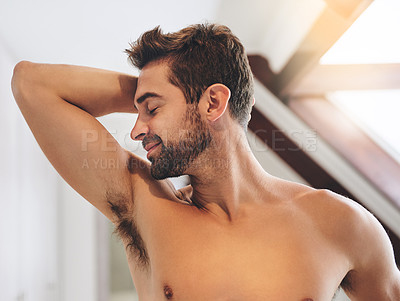 Buy stock photo Man, smell armpit and home for fresh aroma, morning grooming and getting ready with deodorant. Male person, topless guy and inhale scent of fragrance or perfume, underarm and hygiene satisfaction