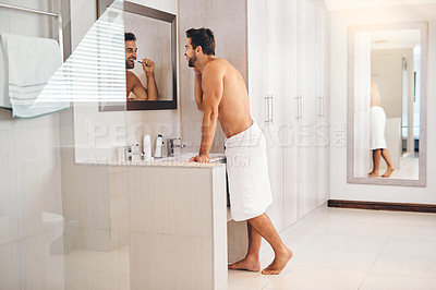 Buy stock photo Happy man, bathroom and brushing teeth at mirror for healthy smile, dental hygiene and gum care. Shirtless guy, shower and cleaning mouth with toothbrush for fresh breath, grooming or morning routine