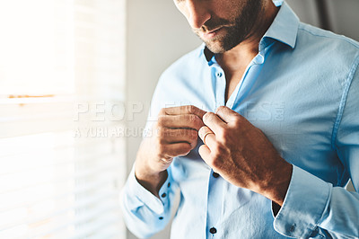 Buy stock photo Hands, man and button shirt of clothes for job interview, work event and corporate fashion for business. Closeup, male person and ready in professional outfit from wardrobe in the morning at home