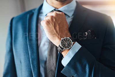 Buy stock photo Cropped shot of an unrecognizable man putting on a tie in his bedroom at home