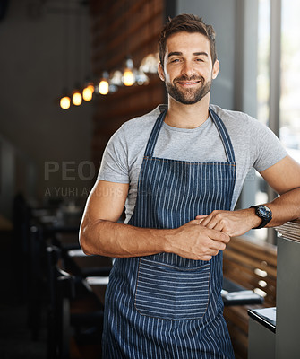 Buy stock photo Portrait of a confident young man working in a cafe