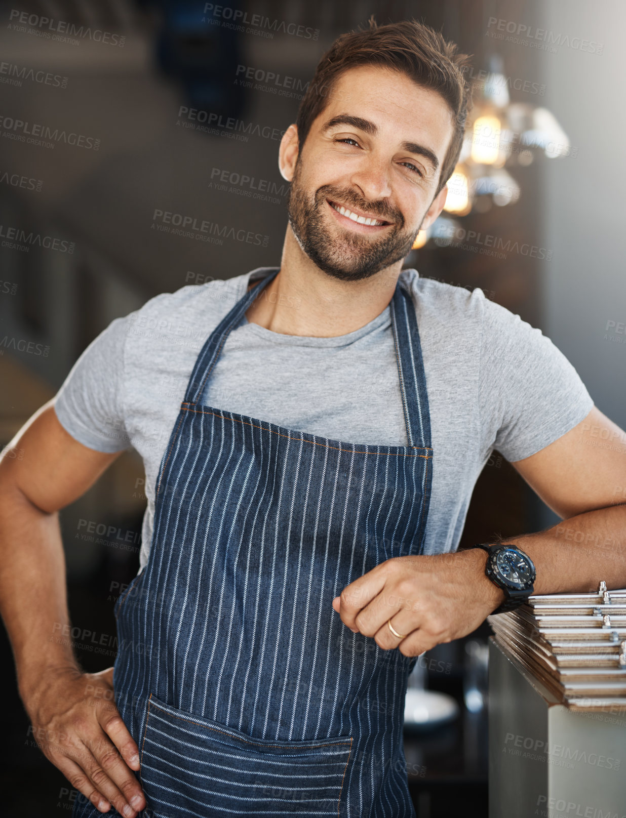 Buy stock photo Portrait, business and man in restaurant, apron and waiter with confidence, career ambition and hospitality. Face, happy person and entrepreneur with service industry, professional and friendly