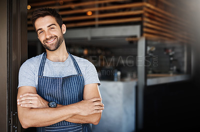 Buy stock photo Portrait of a confident young man working in a cafe