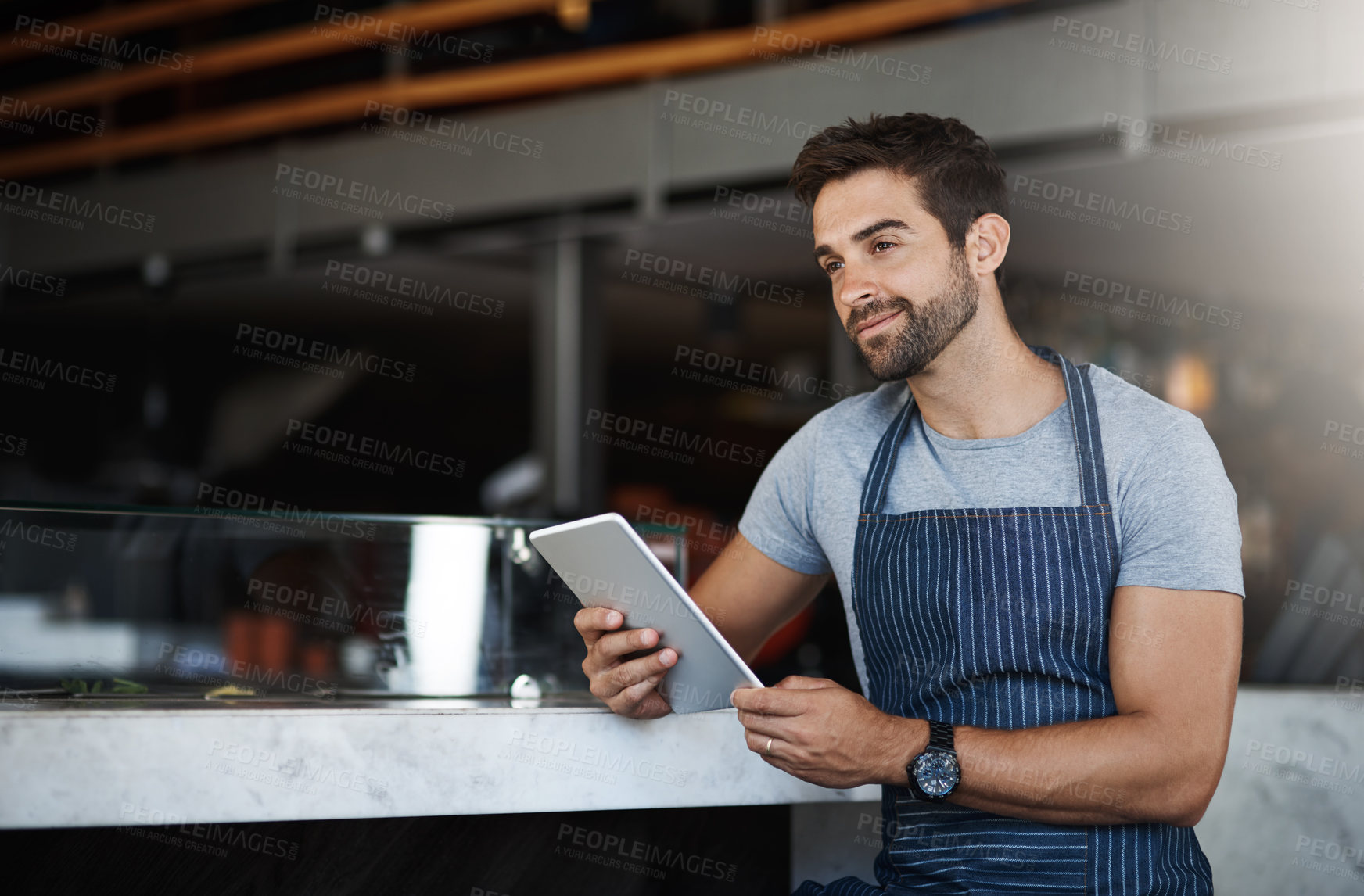 Buy stock photo Thinking, apron and man with tablet, service and internet with digital app, solution and restaurant. Online order, barista and entrepreneur with tech, schedule and waiter in cafe, planning and choice