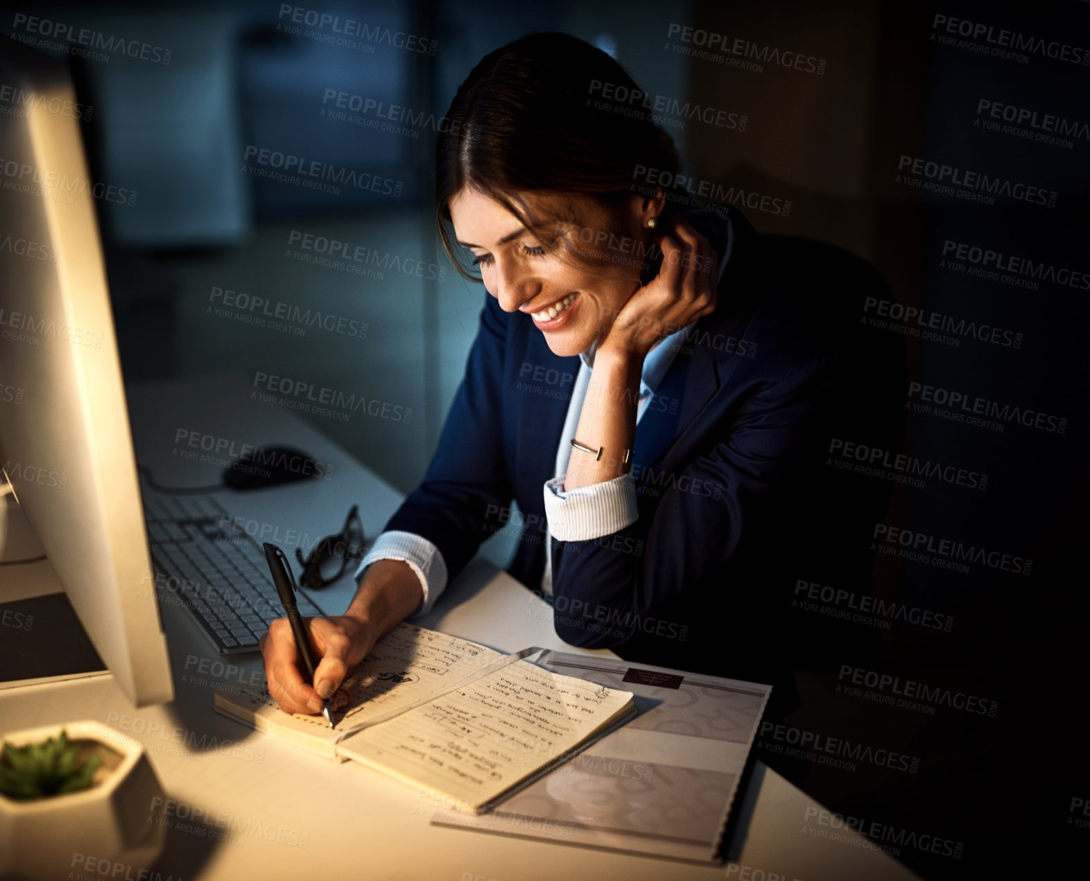 Buy stock photo Book, smile and businesswoman or writing at night or planning and pc in an office. Corporate, dark and female worker or project manager in the evening or company note and dedicated on computer