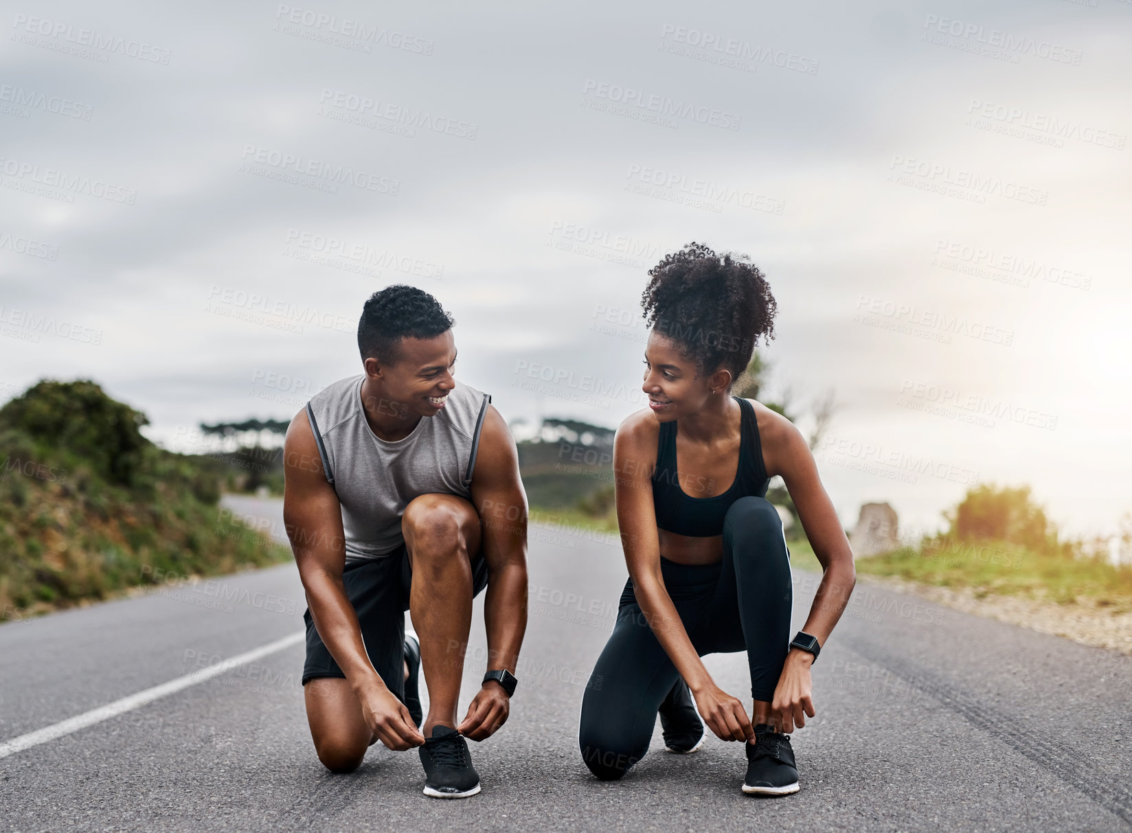 Buy stock photo Nature, sports and couple tie shoelace in road with running exercise for race or marathon training. Fitness, outdoor and team of track and field athletes preparing for cardio workout in mountain.