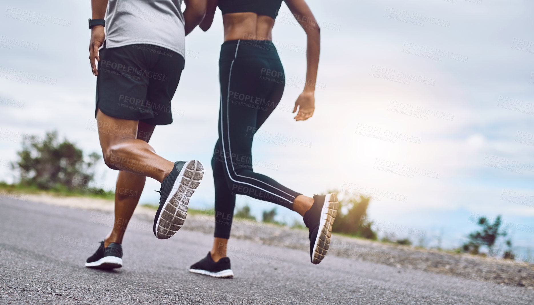 Buy stock photo Closeup shot of a sporty couple exercising together outdoors