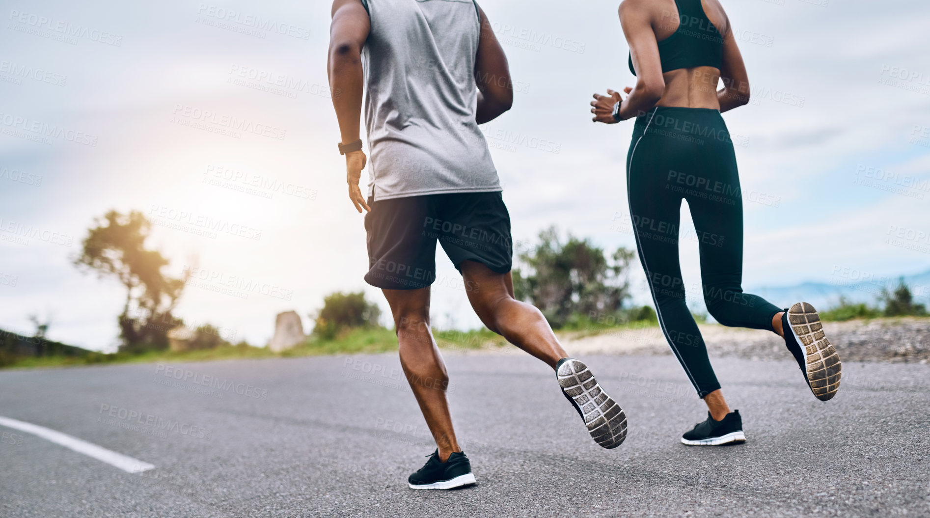 Buy stock photo Closeup shot of a sporty couple exercising together outdoors