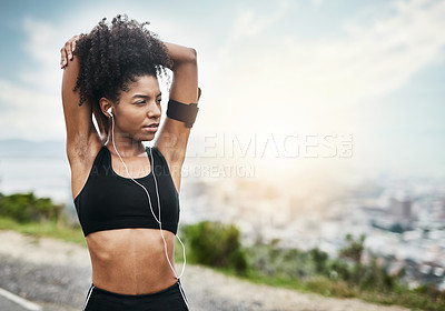 Buy stock photo Fitness, woman and stretching arms for running outdoors with music for health, workout or cardio routine. Stretch, exercise and African female runner in nature with podcast for training motivation