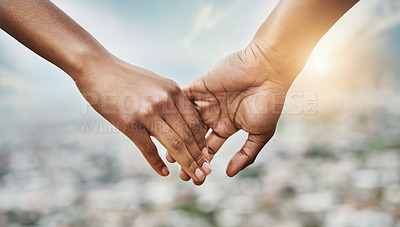 Buy stock photo Closeup shot of an unrecognizable couple holding hands together outdoors