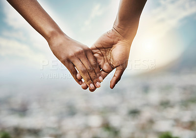 Buy stock photo Closeup shot of an unrecognizable couple holding hands together outdoors