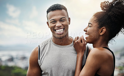 Buy stock photo Shot of a sporty young couple exercising together outdoors