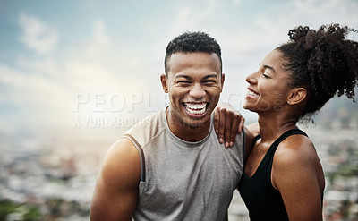 Buy stock photo Shot of a sporty young couple exercising together outdoors