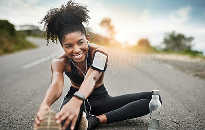 Buy stock photo Fitness, stretching and black woman on road with headphones for wellness, health and sports in city. Runner, happy and person listening to audio, music or podcast for exercise, training and workout 