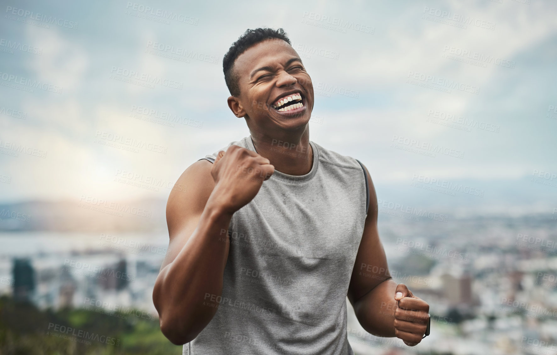 Buy stock photo Cropped shot of a handsome young sportsman cheering in celebration outside