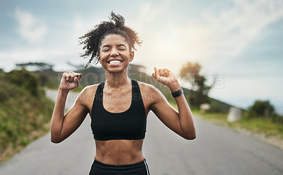 Buy stock photo Cropped shot of an attractive young sportswoman cheering in celebration outside