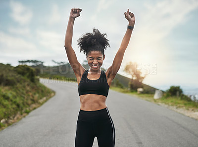 Buy stock photo Cropped shot of an attractive young sportswoman cheering in celebration outside