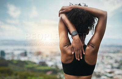 Buy stock photo Rearview shot of an unrecognizable young sportswoman warming up for a workout outdoors