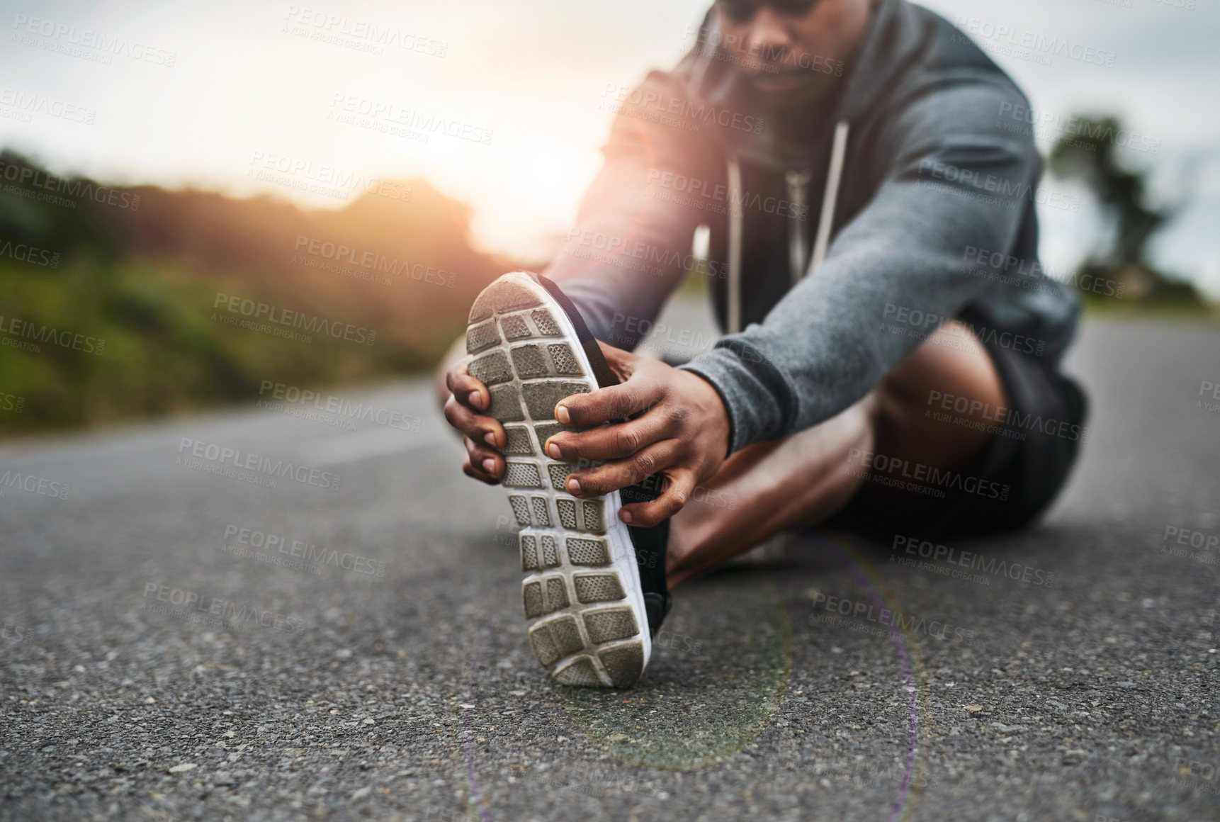 Buy stock photo Exercise, foot and stretching with runner on asphalt road for training or workout preparation. Fitness, legs and warm up with athlete getting ready outdoor on street for cardio start in morning