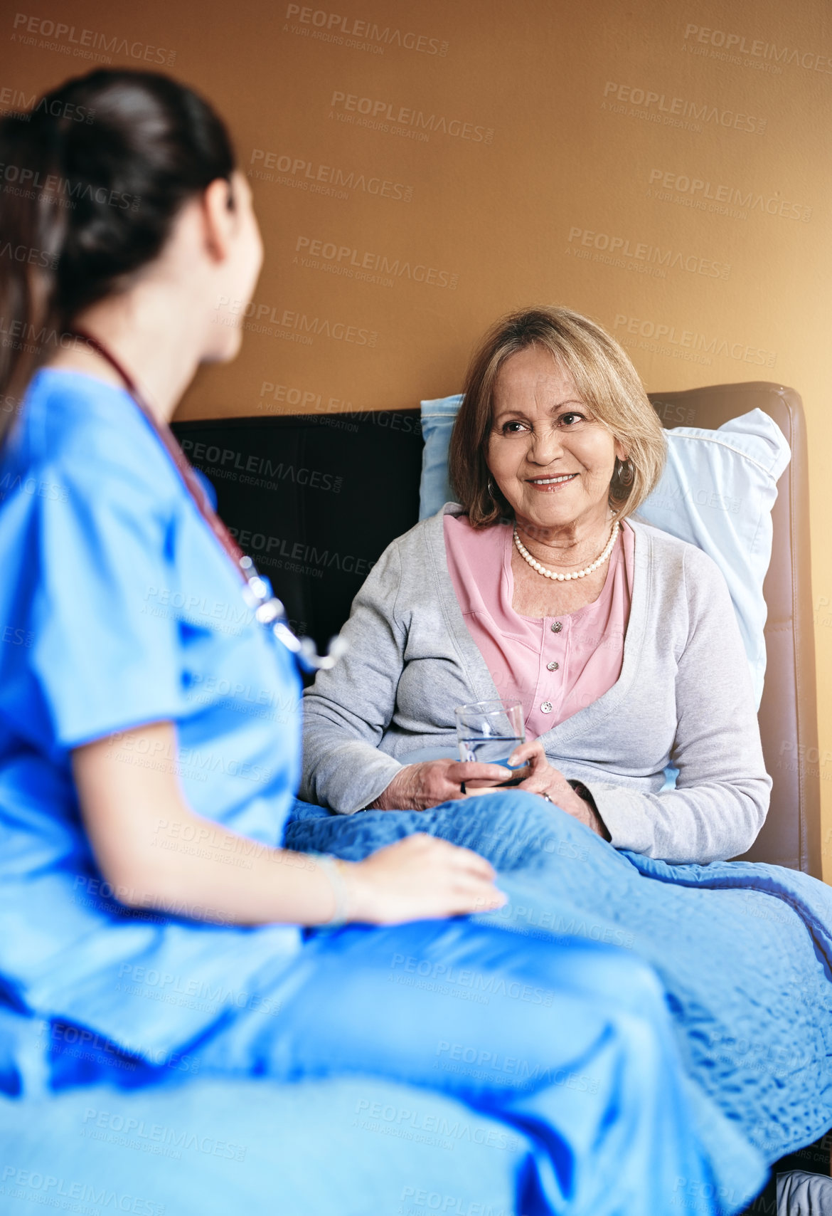 Buy stock photo Elderly, woman and caregiver with drinking medication at retirement facility for healthcare and prescription drugs. Senior, patient or nurse in nursing home with pills, support and water for wellness