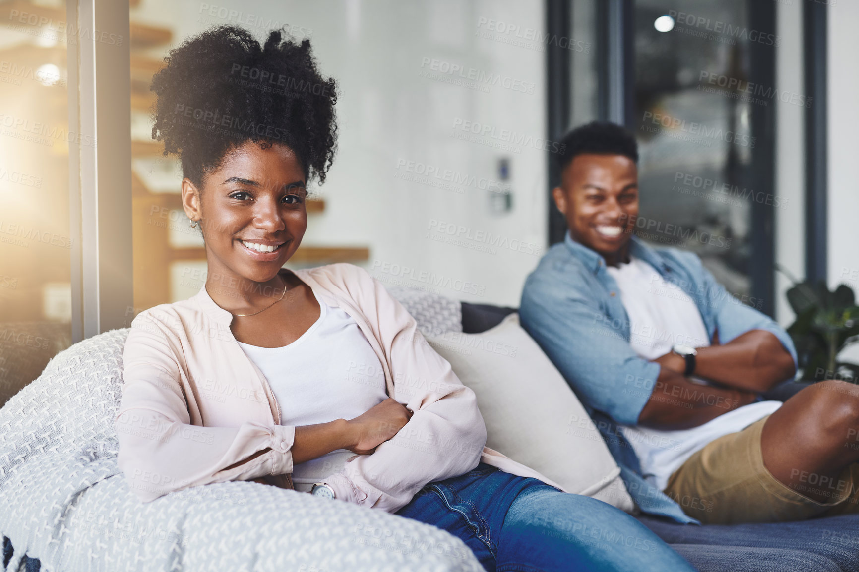 Buy stock photo Couple, woman and portrait with smile on sofa in home for relax, confidence or weekend chill. People, face or happy together on couch in living room with laughing, funny day off or humor in apartment