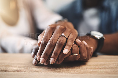 Buy stock photo Cropped shot of a man and woman holding hands at a table