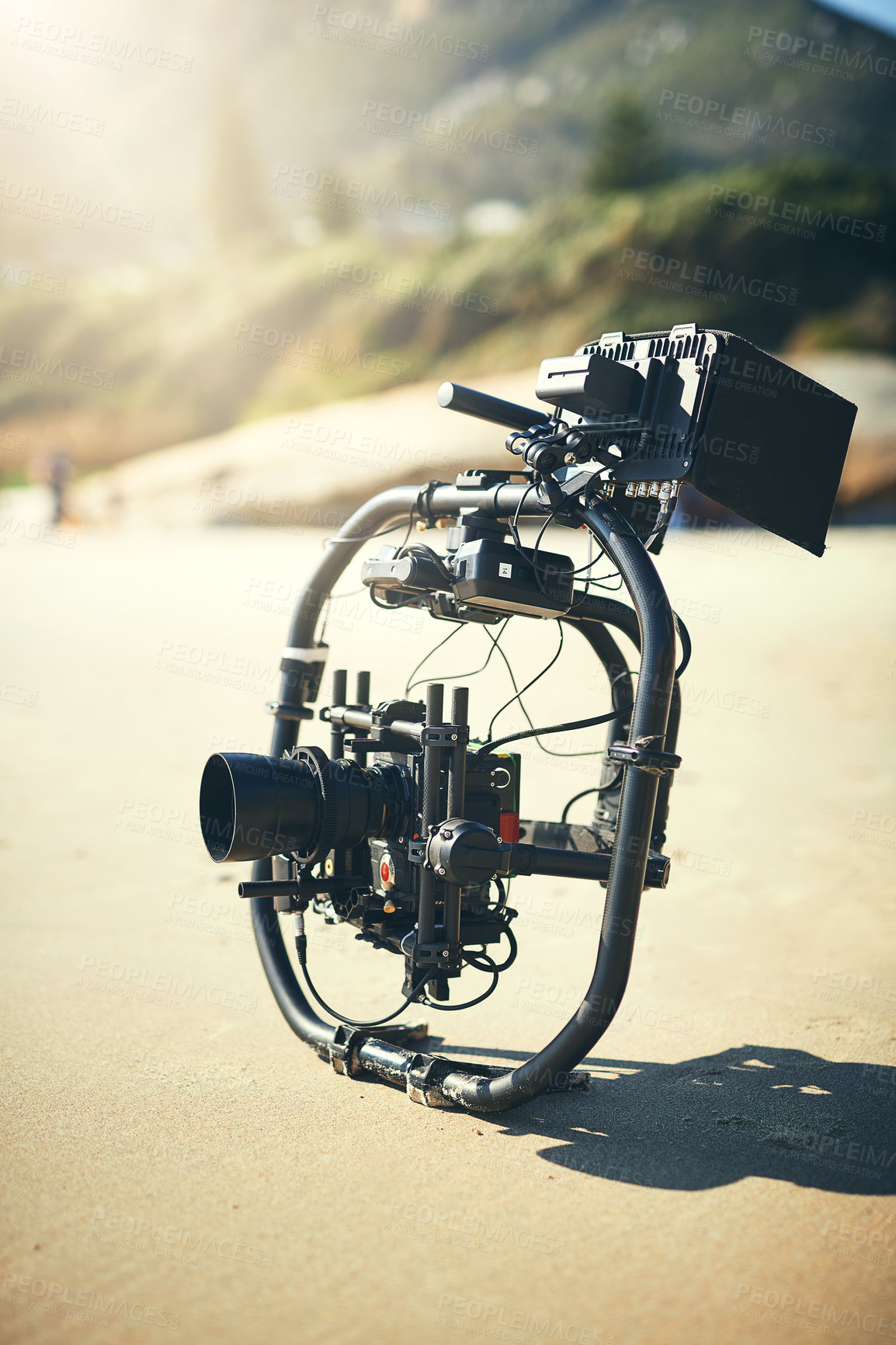 Buy stock photo Filmmaking, video camera and equipment for photoshoot results, content or quality control. Videography process, closeup and technology for nature, movie or production with professional gear on beach