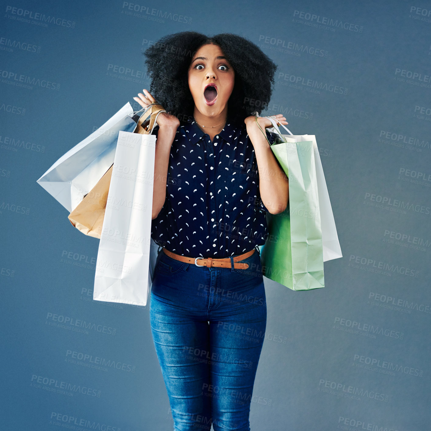 Buy stock photo Happy woman, portrait and surprise with shopping bags for deal, announcement or promotion on a studio background. Young female person, shopper or customer in shock, wow or OMG for purchase or buying