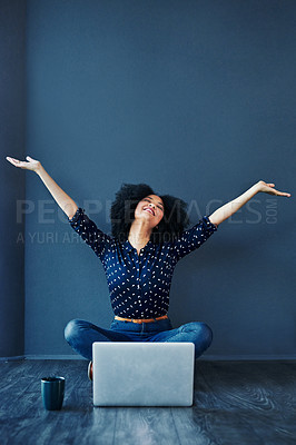Buy stock photo Laptop, success and businesswoman in celebration on the floor by a blue wall with a mug. Happy, smile and excited professional female employee with an achievement or goals to celebrate with computer.