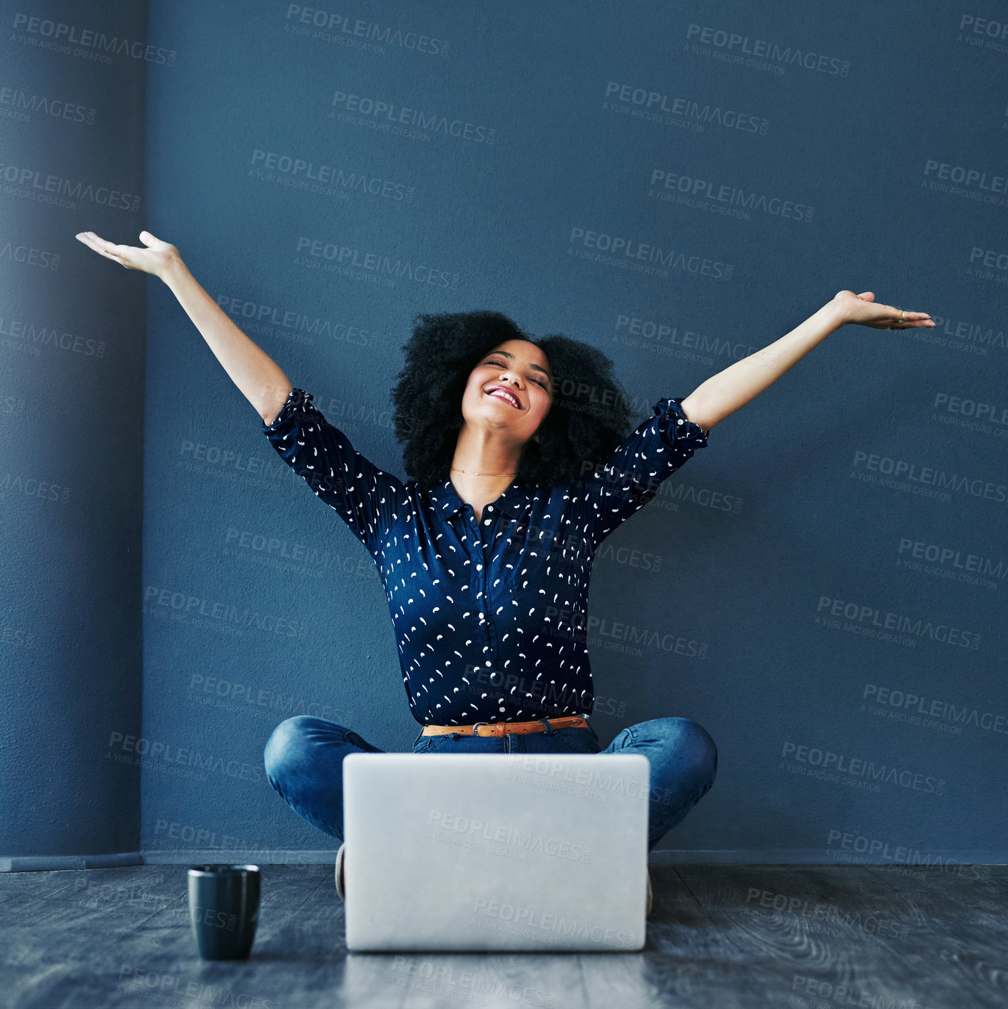 Buy stock photo Laptop, achievement and woman in celebration on the floor by a blue wall for good news or success. Happy, smile and excited professional female employee with job promotion to celebrate with computer.