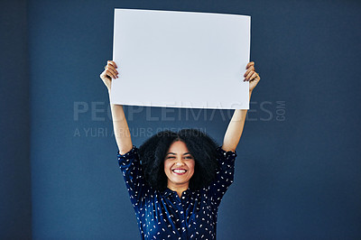 Buy stock photo Paper, mockup and portrait of happy woman in studio with banner for news, social media or advertising on blue background. Space, billboard and female smile with poster, sticker and branding promotion