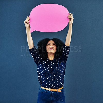 Buy stock photo Speech bubble, mockup and woman in studio with banner for news, social media or advertising on blue background. Space, billboard and female person with paper, poster or branding, launch or promotion
